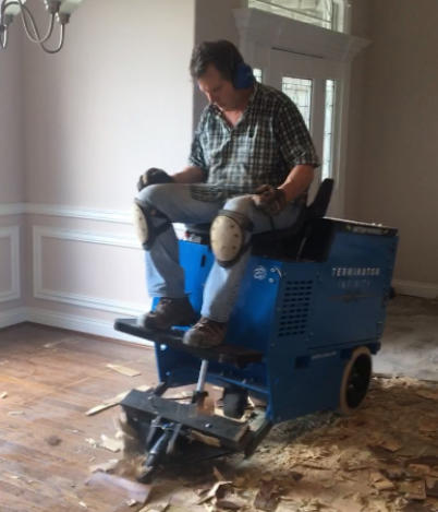 This is the removal of a glued down wood floor in the Bella Vista area getting it ready for a nice floating wood floor installation.