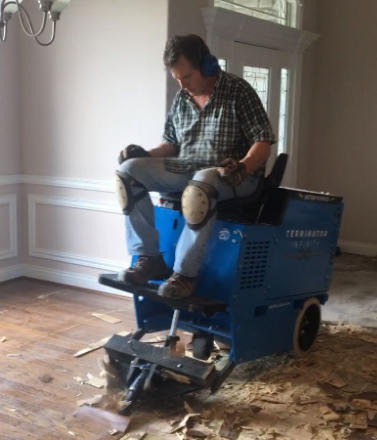 This is a picture of our larger sit on floor stripper removing old glue down wood flooring in Springdale AR.
